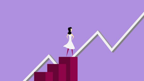 Vector-based graphic of a woman standing on an ascending bar graph. There is also a line graph that is ascending upwards