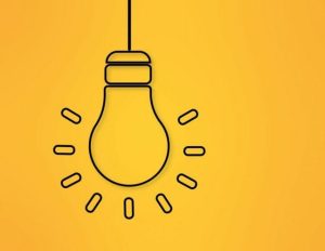 Stylistic lineart of a glowing lightbulb on a cheery yellow background