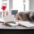 A woman with her head on the desk, unengaged