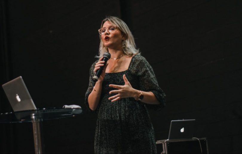 Woman giving a speech on stage