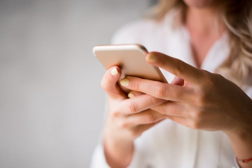 A woman using her mobile device.