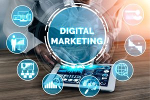 The words "Digital Marketing" and related images over a photo of a person holding a tablet.