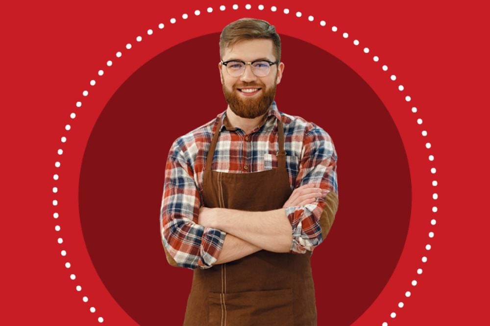 An image of a smiling server on a background of Smart Serve Ontario's branded shades of red.